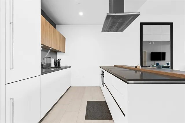 a kitchen with a sink and a refrigerator