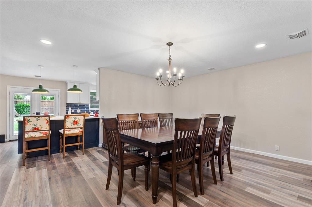 613 Edwards Drive Denison, TX 75020 - Photo 11 of 31 a view of a dining room with furniture wooden floor and chandelier