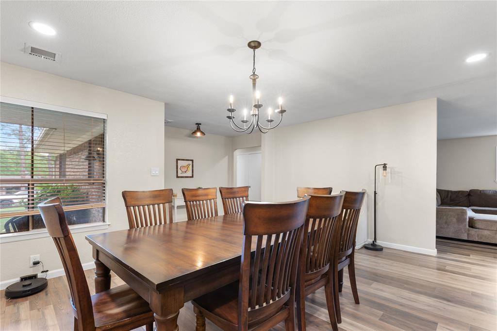 613 Edwards Drive Denison, TX 75020 - Photo 12 of 31 a view of a dining room with furniture window and wooden floor