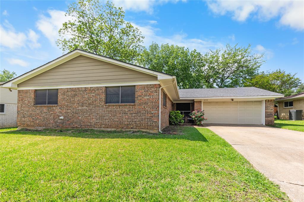 613 Edwards Drive Denison, TX 75020 - Photo 14 of 31 a front view of a house with yard and green space
