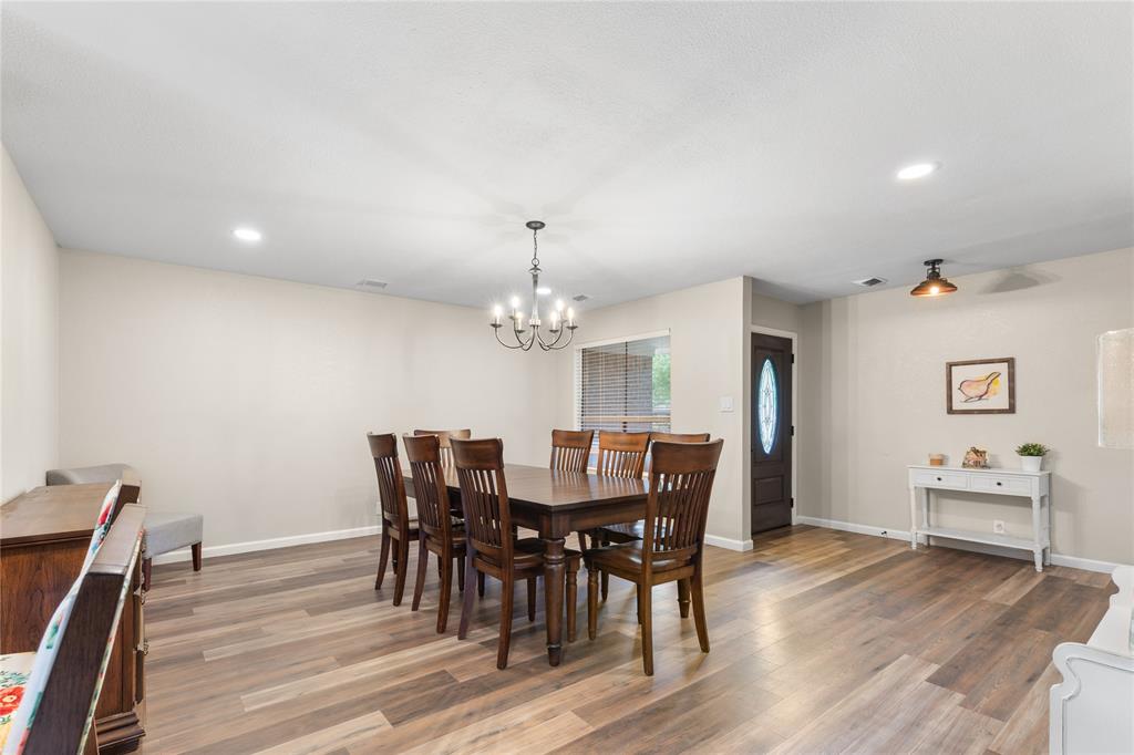 613 Edwards Drive Denison, TX 75020 - Photo 25 of 31 a view of a dining room with furniture and wooden floor