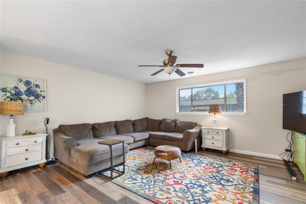 613 Edwards Drive Denison, TX 75020 - Photo 27 of 31 a living room with furniture and a flat screen tv
