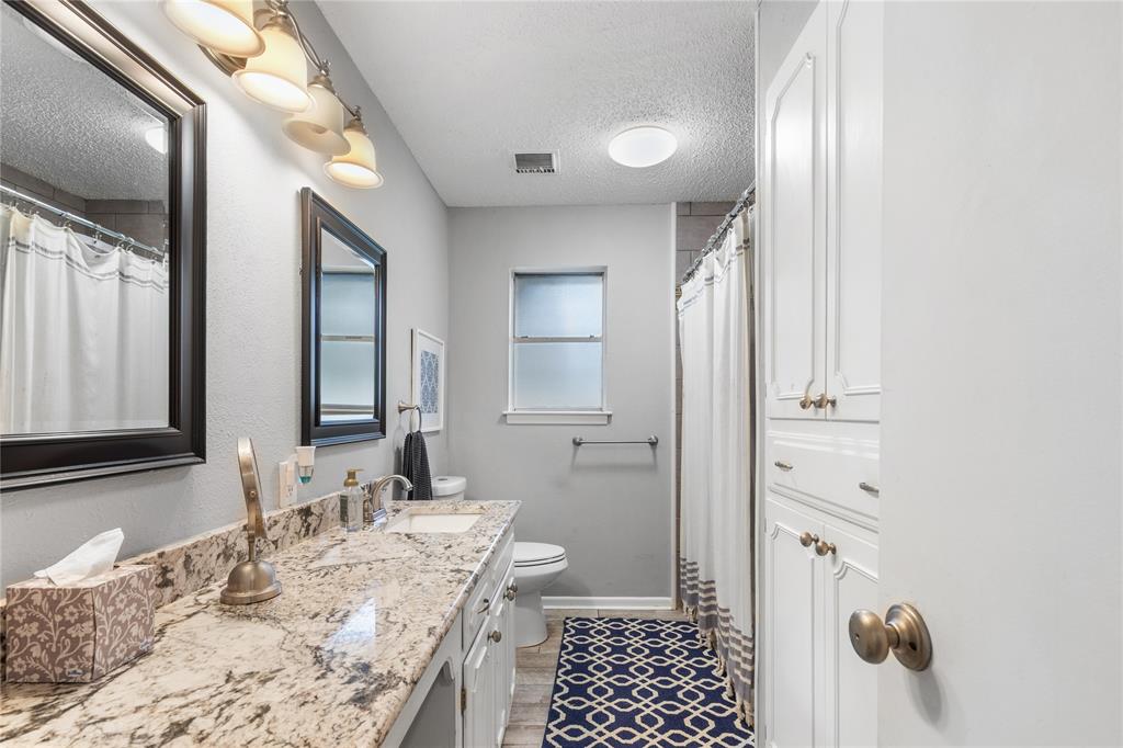 613 Edwards Drive Denison, TX 75020 - Photo 10 of 31 a bathroom with a sink and a mirror