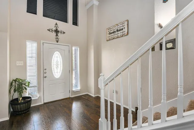 a view of entryway with wooden floor