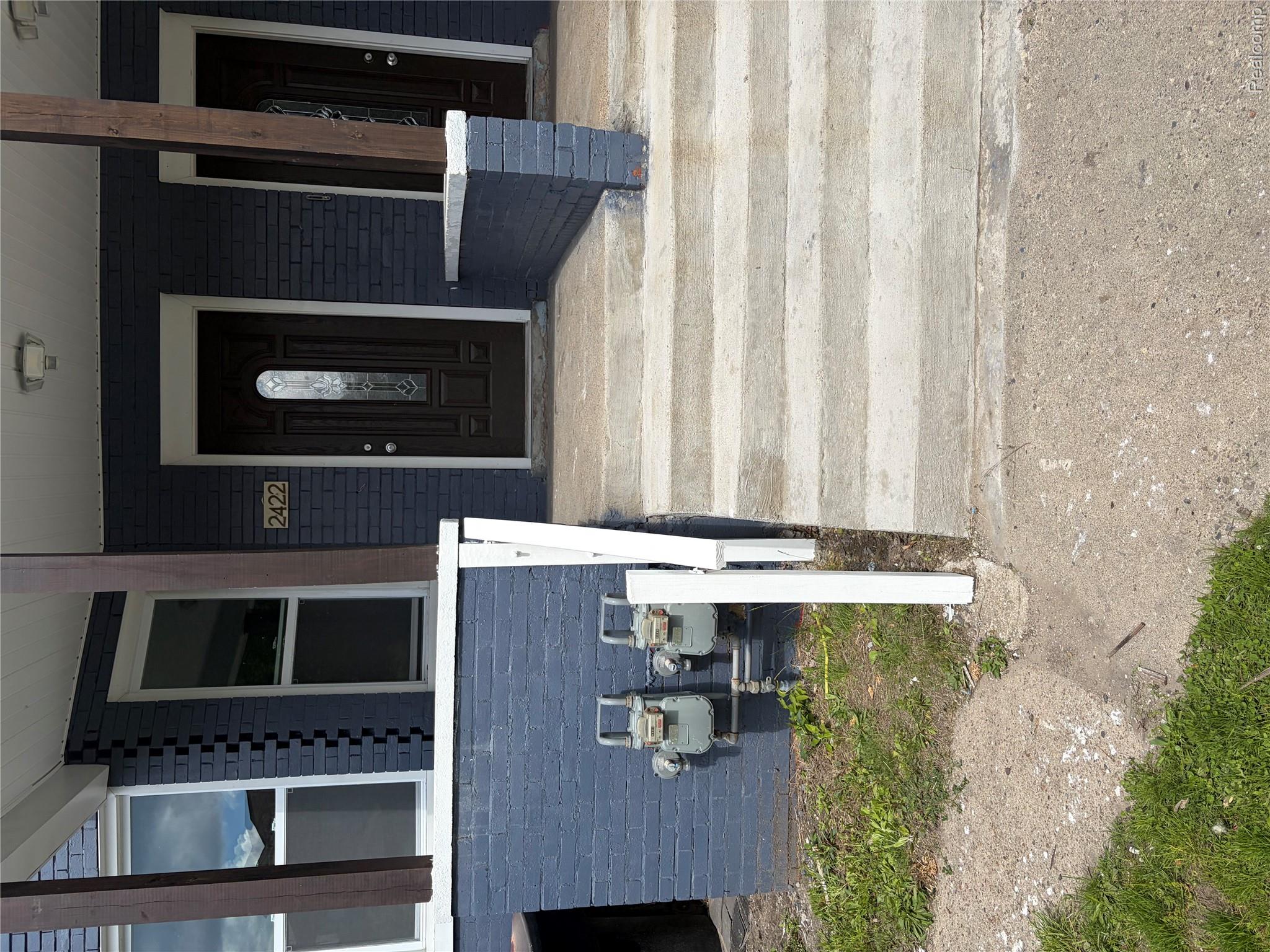 2420 Field Street Detroit, MI 48214 - Photo 1 of 15 View of exterior entry featuring a porch and brick siding