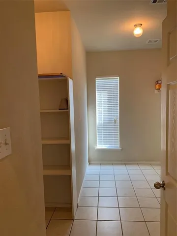 a view of an empty room and window