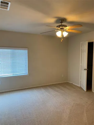 a view of a two chairs in the balcony