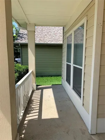 a view of a room with wooden floor and outdoor space