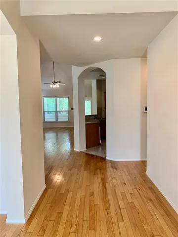 a view of wooden floor and windows in a room