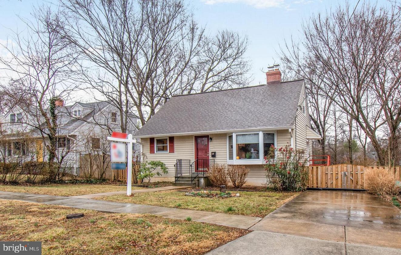 1002 Laredo Road Silver Spring, MD 20901 - Photo 1 of 70 a view of a house with a yard covered in snow