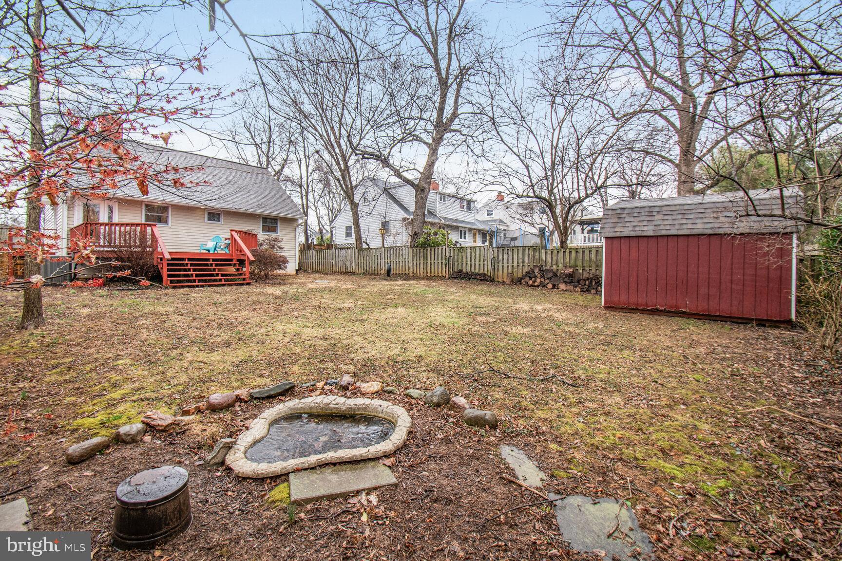 1002 Laredo Road Silver Spring, MD 20901 - Photo 22 of 70 a backyard of a house with fire pit and couches