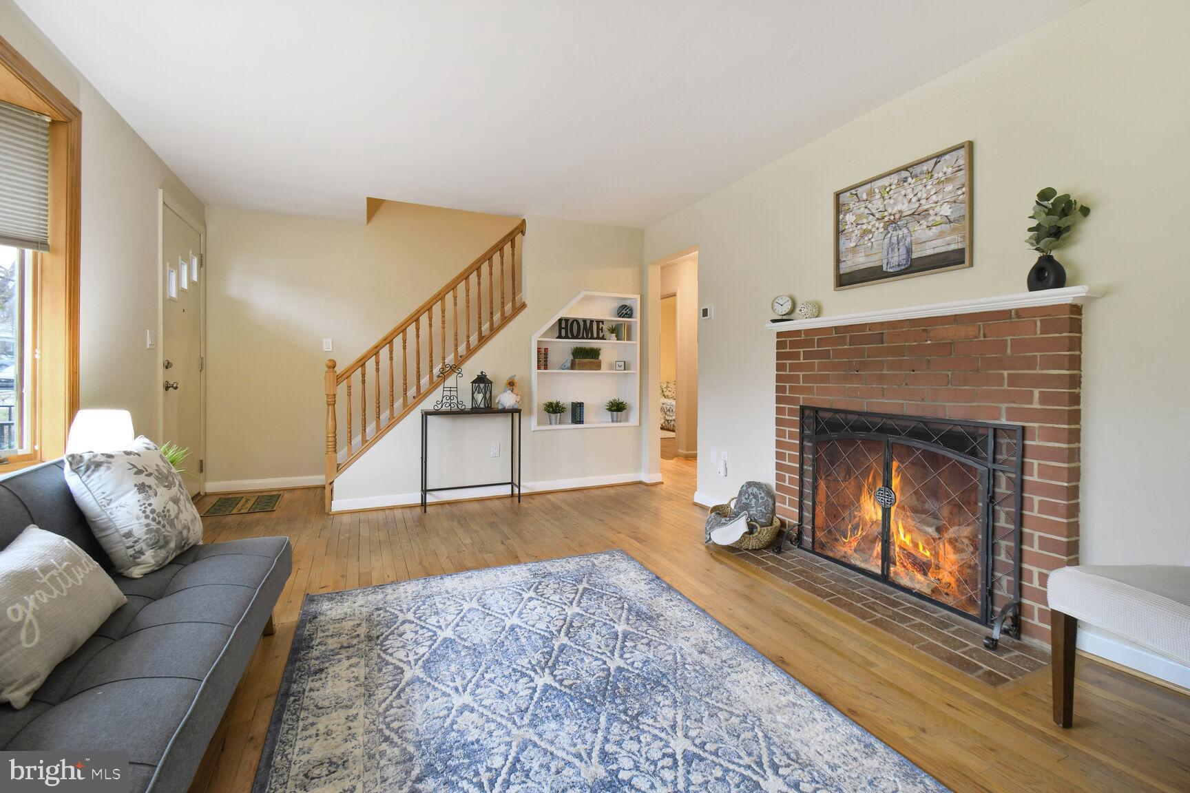 1002 Laredo Road Silver Spring, MD 20901 - Photo 3 of 70 a living room with furniture and a fireplace