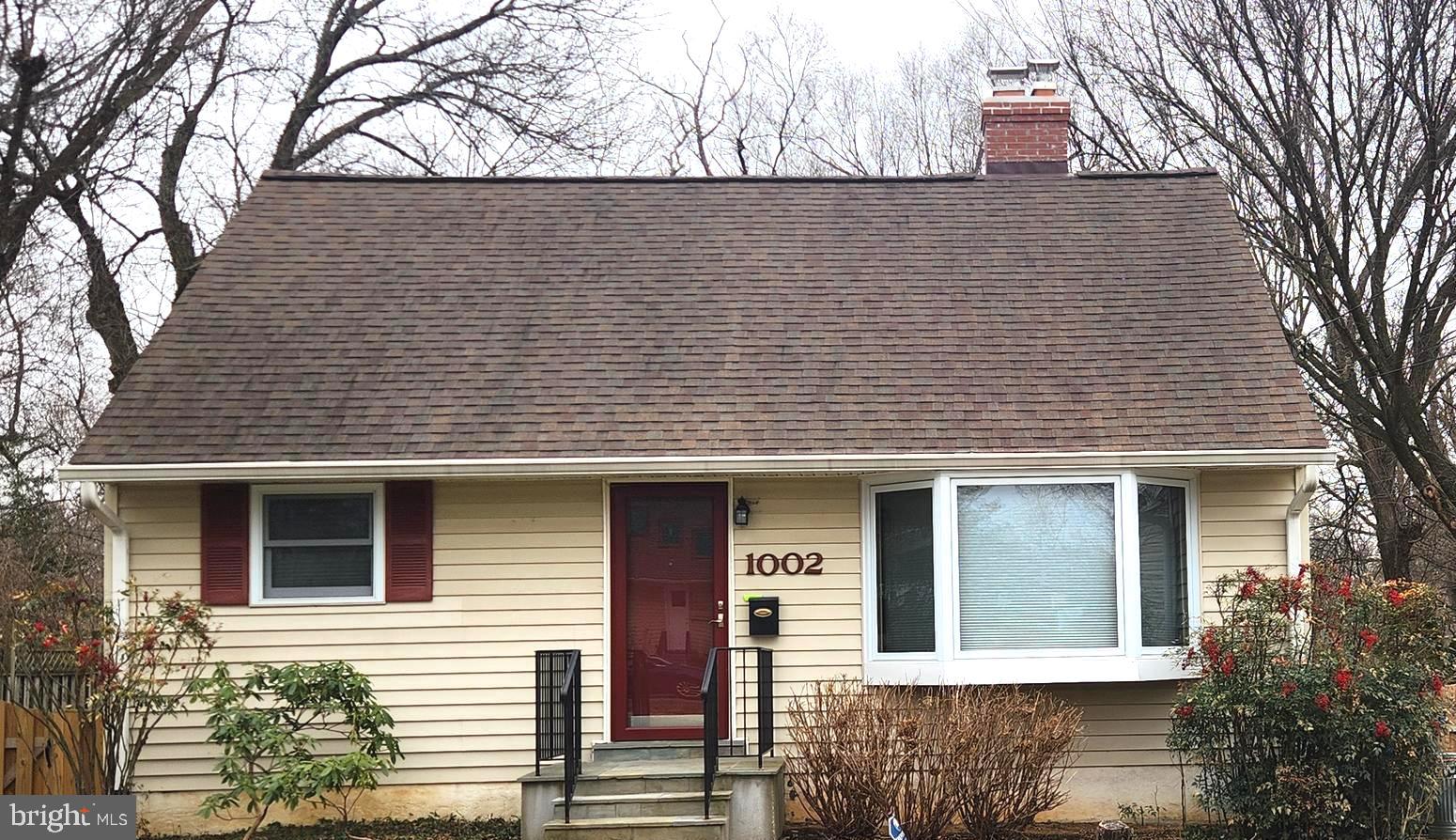 1002 Laredo Road Silver Spring, MD 20901 - Photo 46 of 70 a front view of a house with a tree