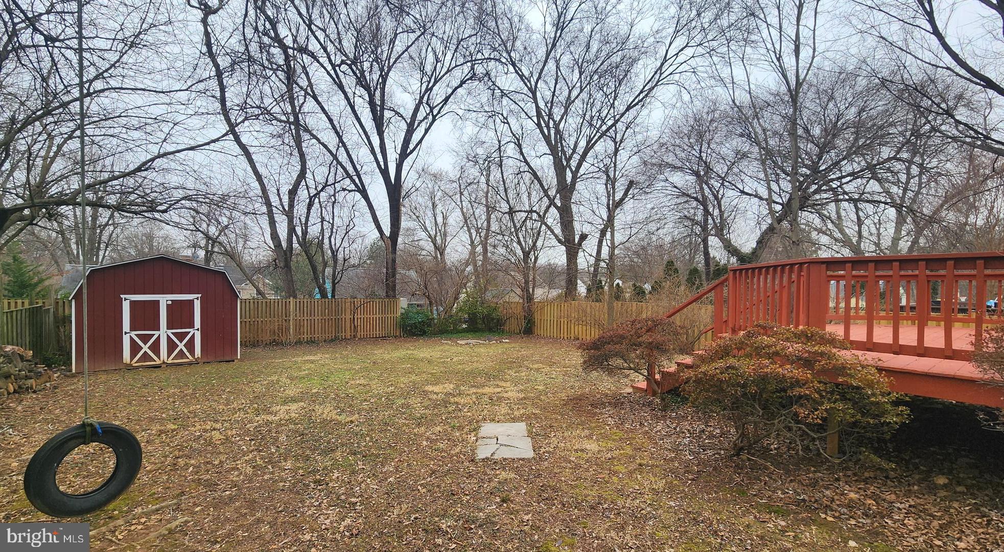 1002 Laredo Road Silver Spring, MD 20901 - Photo 49 of 70 a view of a small yard in front of a house with a large tree