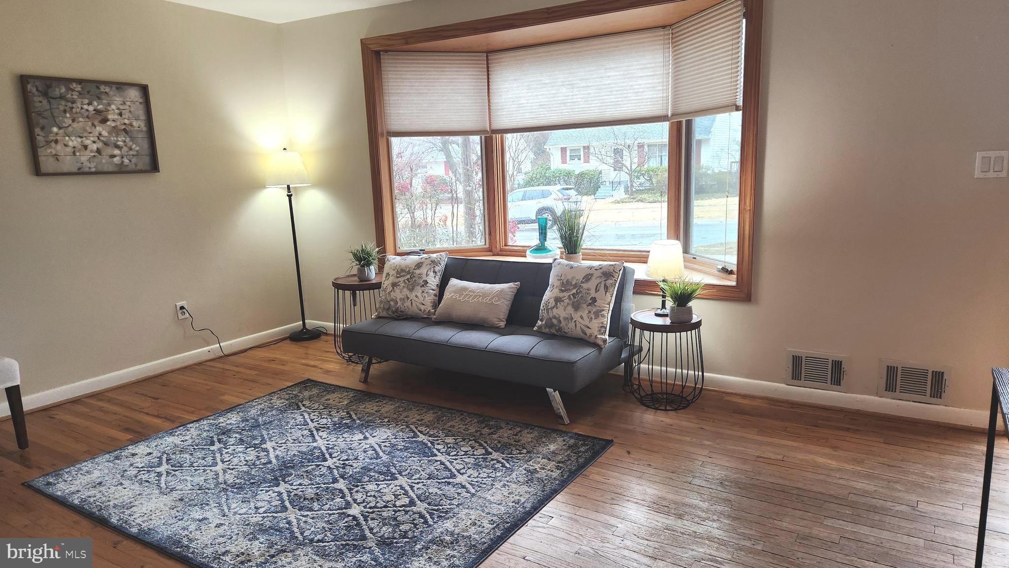 1002 Laredo Road Silver Spring, MD 20901 - Photo 58 of 70 a living room with furniture and a rug