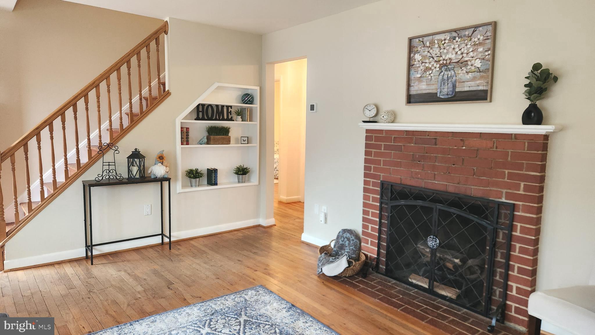 1002 Laredo Road Silver Spring, MD 20901 - Photo 59 of 70 a living room with furniture and a fireplace