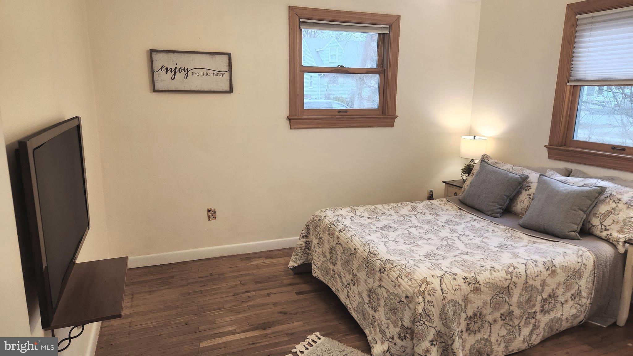 1002 Laredo Road Silver Spring, MD 20901 - Photo 69 of 70 a large bed sitting in a bedroom next to a window