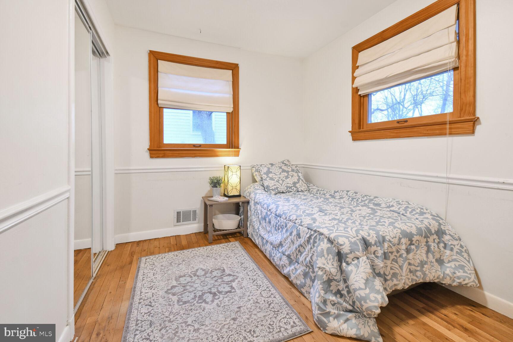 1002 Laredo Road Silver Spring, MD 20901 - Photo 10 of 70 a bedroom with a bed and wooden floor