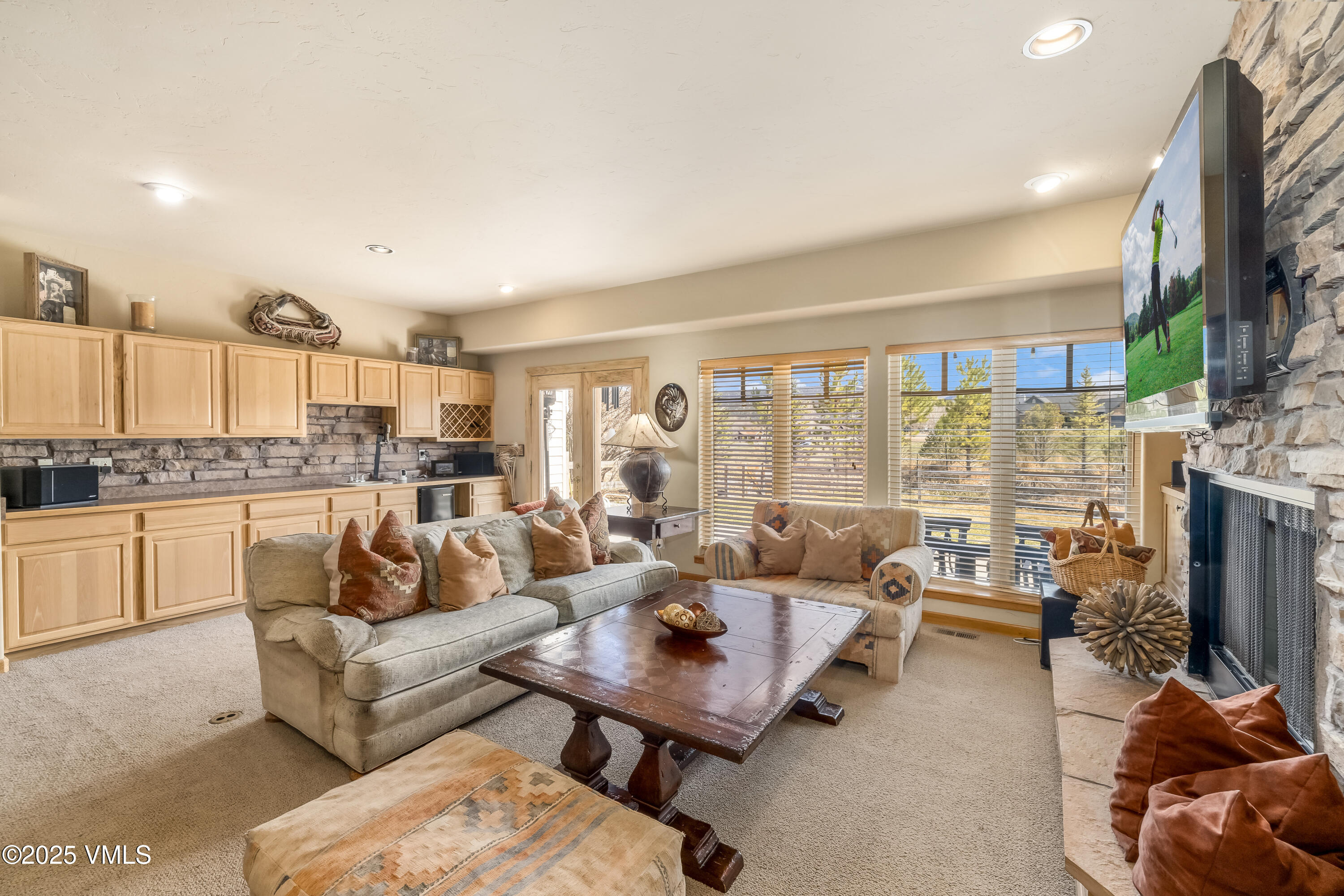 111 East Double Hitch Eagle, CO 81631 - Photo 15 of 38 a living room with fireplace furniture and a flat screen tv