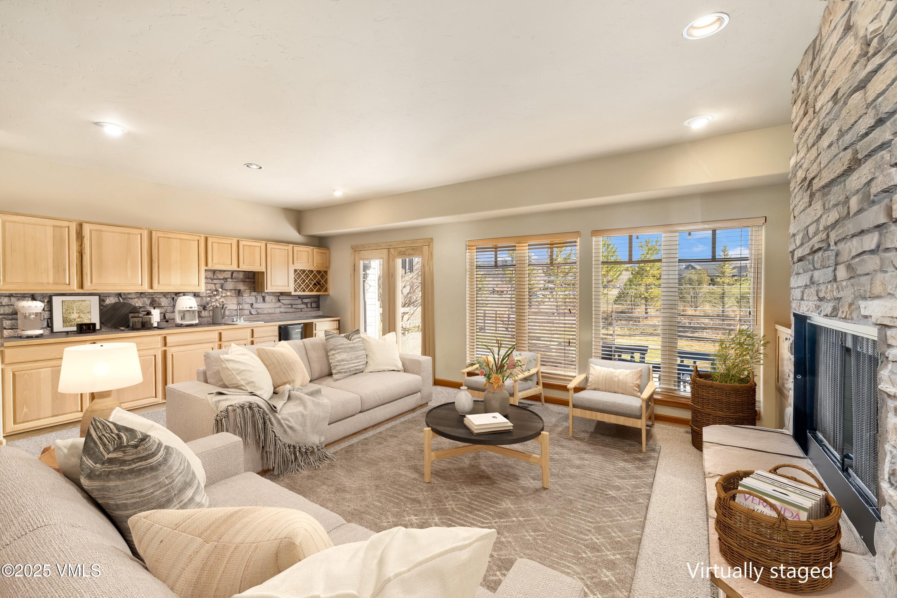 111 East Double Hitch Eagle, CO 81631 - Photo 16 of 38 a living room with furniture large windows and a flat screen tv
