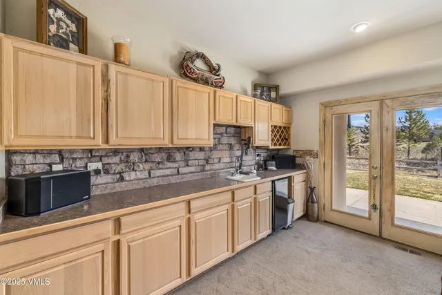 a kitchen with sink cabinets and window