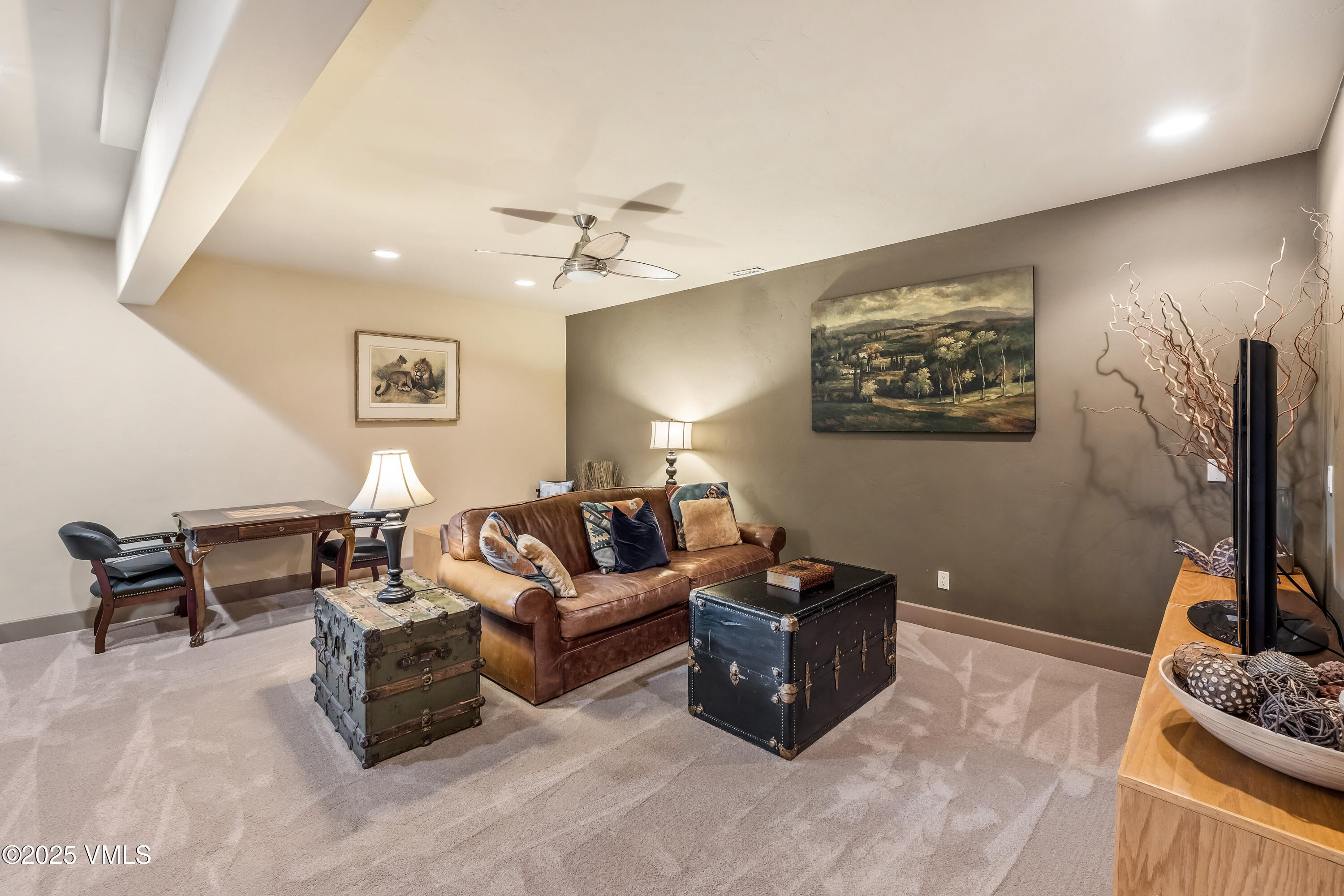 111 East Double Hitch Eagle, CO 81631 - Photo 24 of 38 a living room with furniture a couch and a flat screen tv