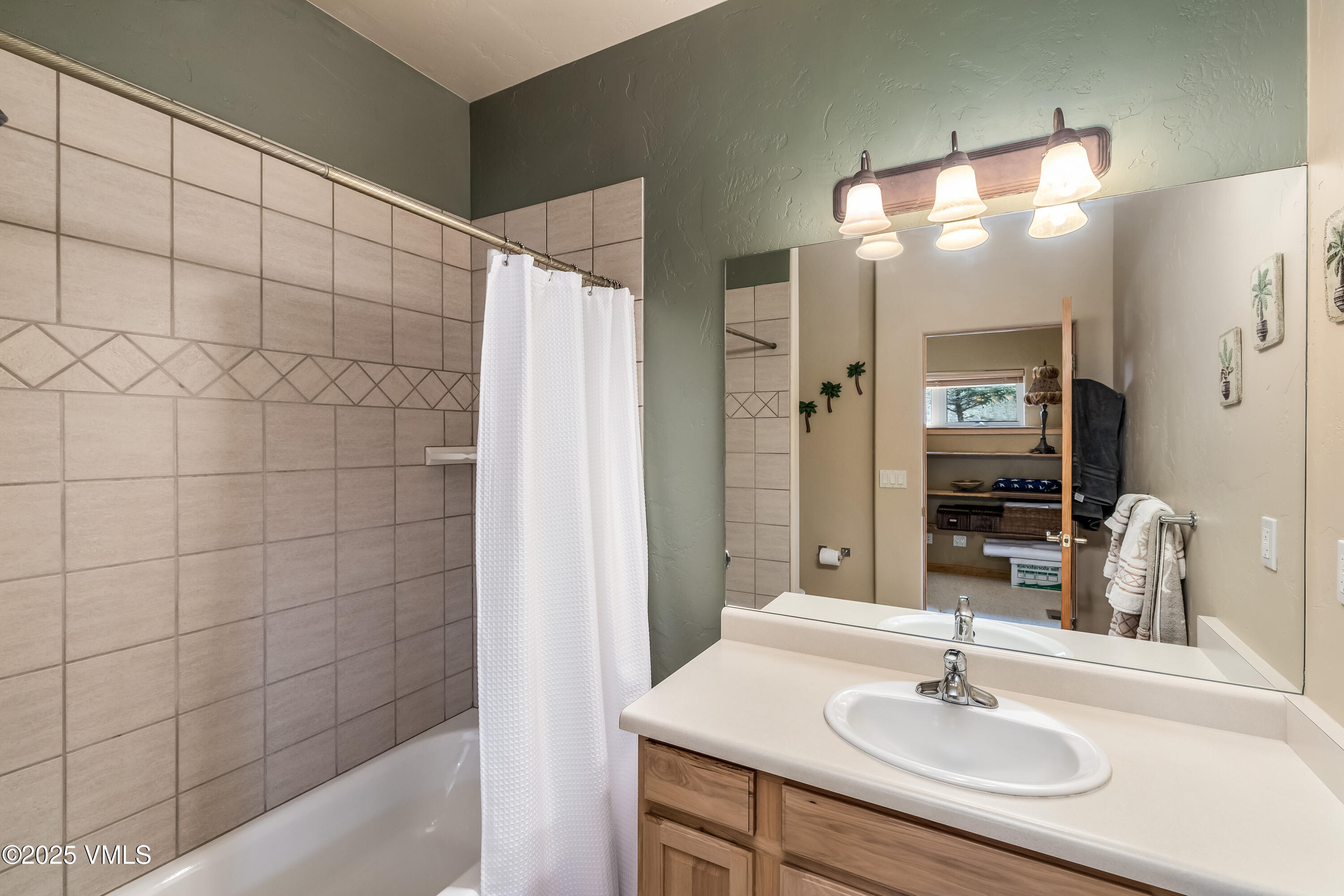 111 East Double Hitch Eagle, CO 81631 - Photo 30 of 38 a bathroom with a sink shower and a mirror