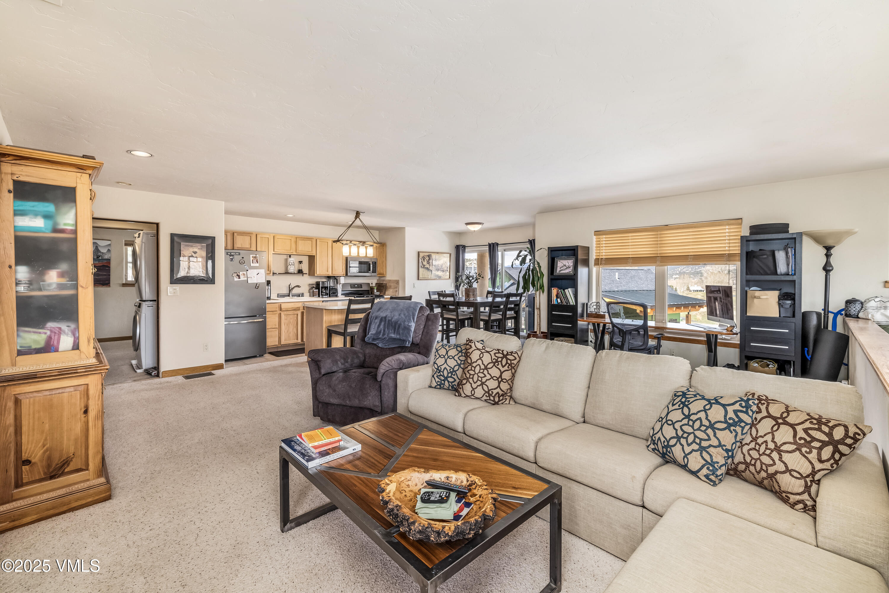111 East Double Hitch Eagle, CO 81631 - Photo 33 of 38 a living room with furniture and a large window