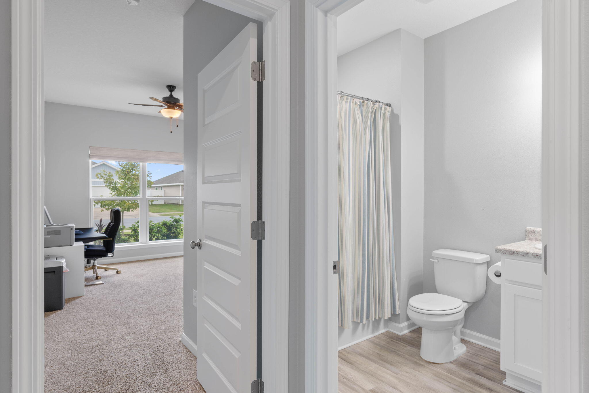 38 Silverthorn Street Freeport, FL 32439 - Photo 27 of 42 a bathroom with a toilet a sink and a large mirror