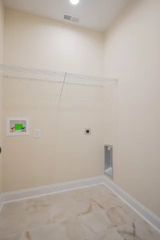 a view of a green yard with a lake