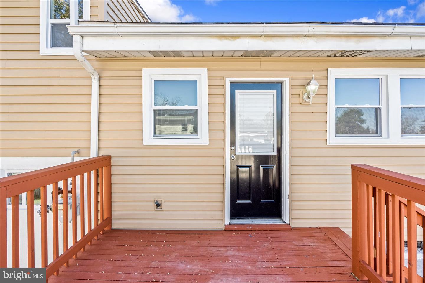4609 Tema Road Pikesville, MD 21208 - Photo 16 of 36 a view of a porch with a door and wooden floor