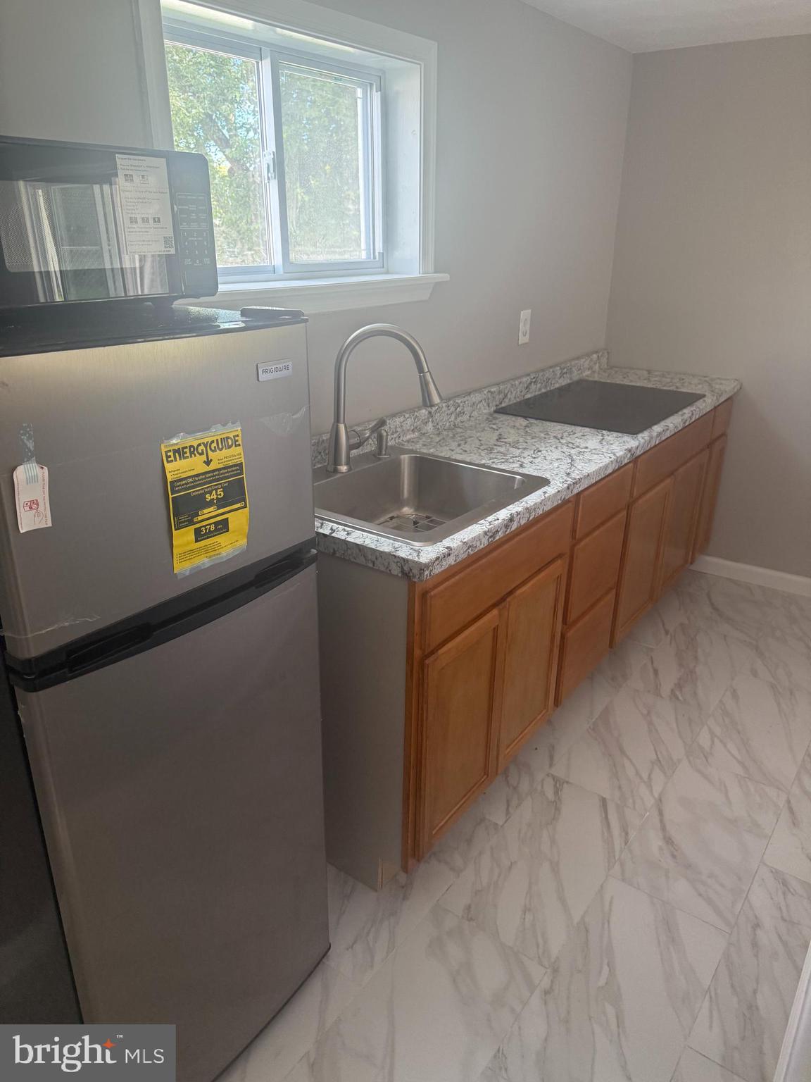 4609 Tema Road Pikesville, MD 21208 - Photo 23 of 36 a bathroom with a sink and a window