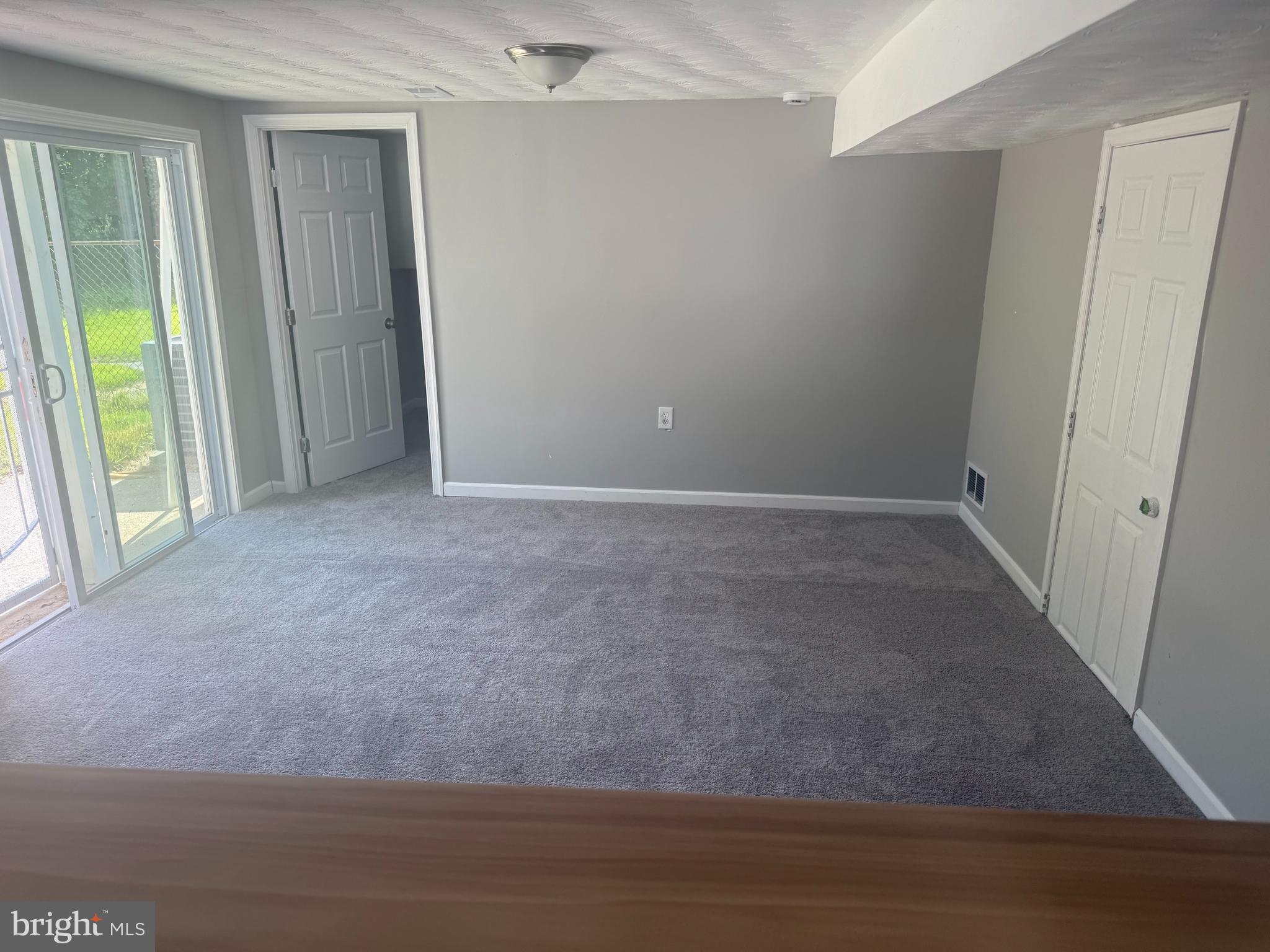 4609 Tema Road Pikesville, MD 21208 - Photo 24 of 36 a view of an empty room and a window