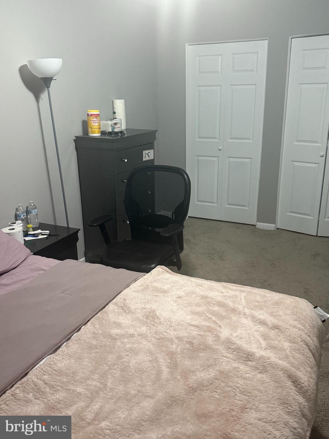 4609 Tema Road Pikesville, MD 21208 - Photo 27 of 36 a bed room with a bed and a lamp