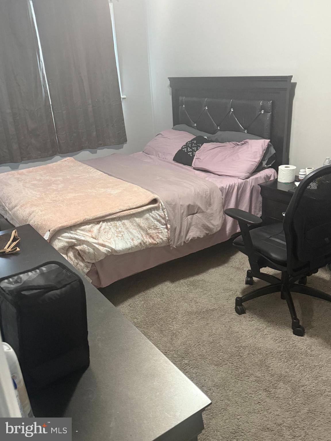 4609 Tema Road Pikesville, MD 21208 - Photo 28 of 36 a bedroom with a bed and chair