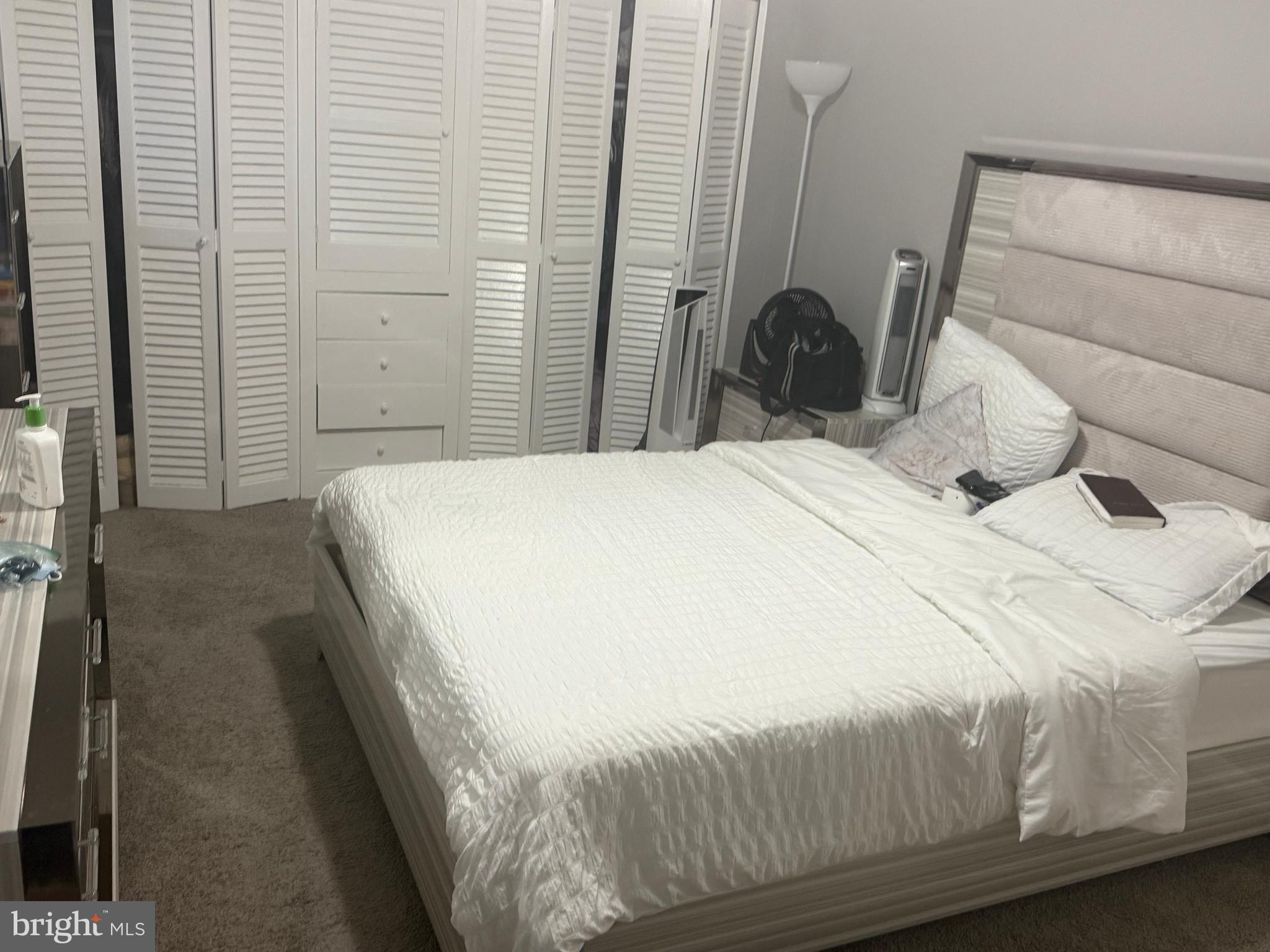 4609 Tema Road Pikesville, MD 21208 - Photo 35 of 36 a bedroom with a bed and a mirror