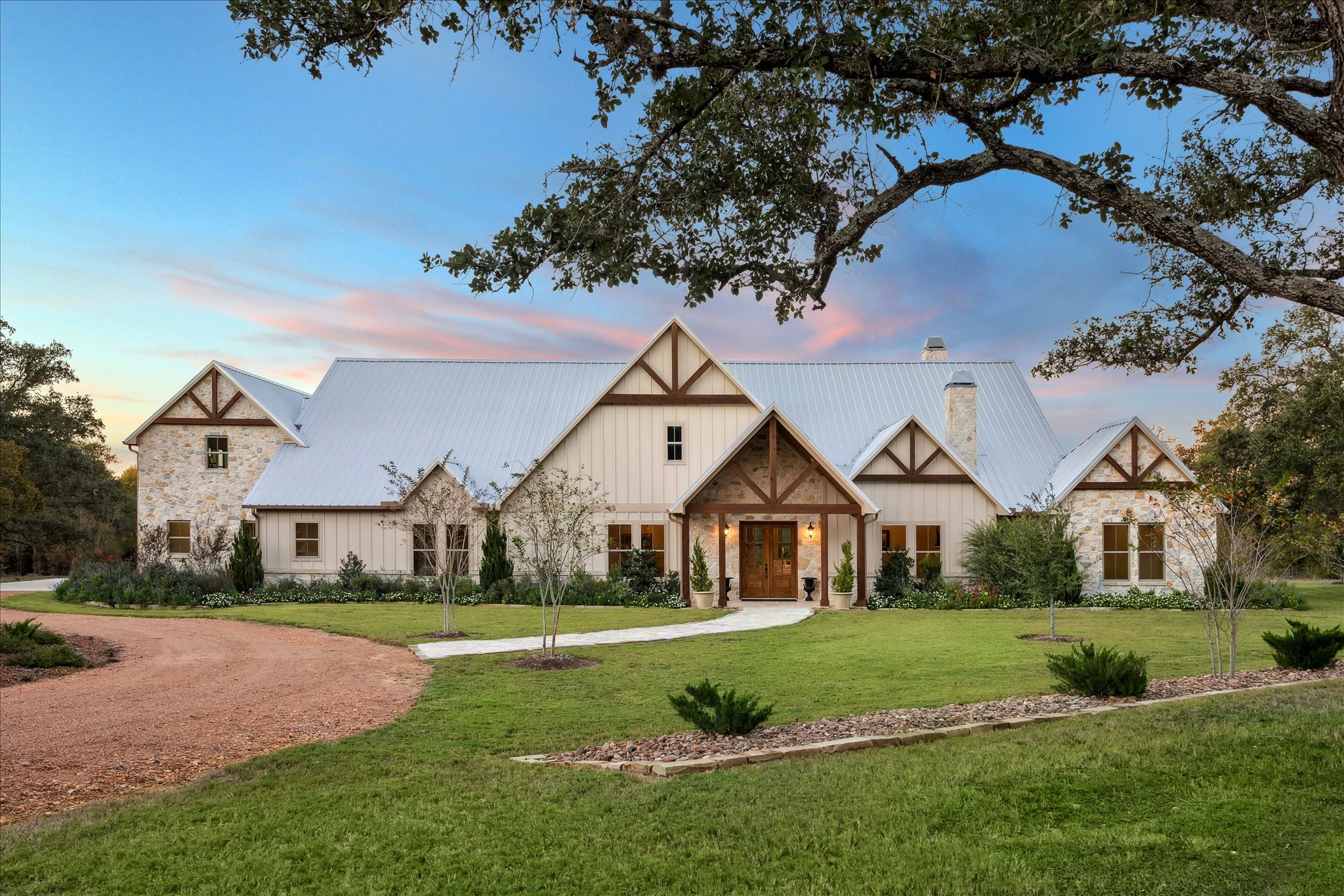 2130 Hartfield Road Round Top, TX 78954 - Photo 2 of 35 a front view of a house with a yard