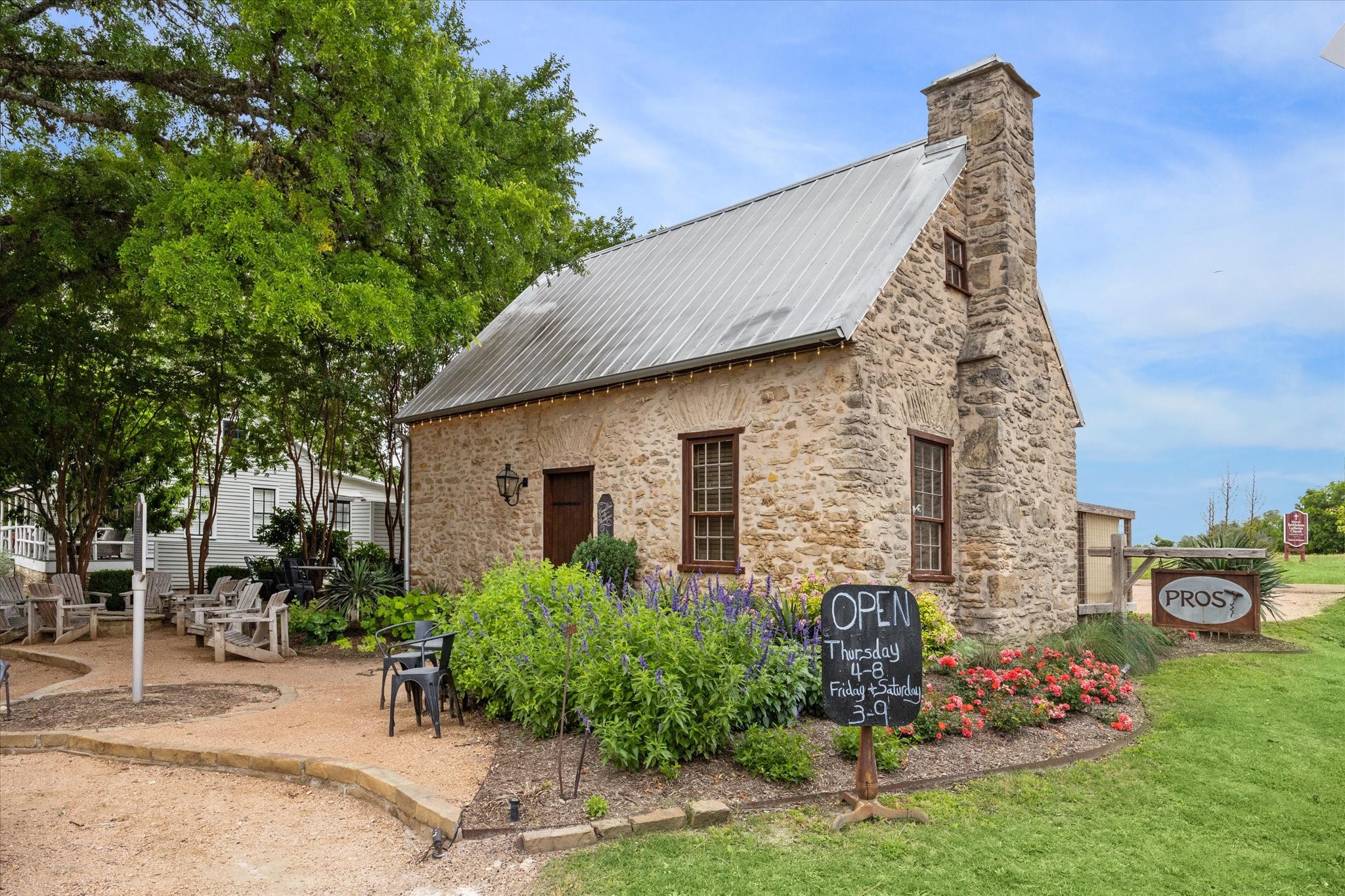 2130 Hartfield Road Round Top, TX 78954 - Photo 25 of 35 a front view of a house with garden