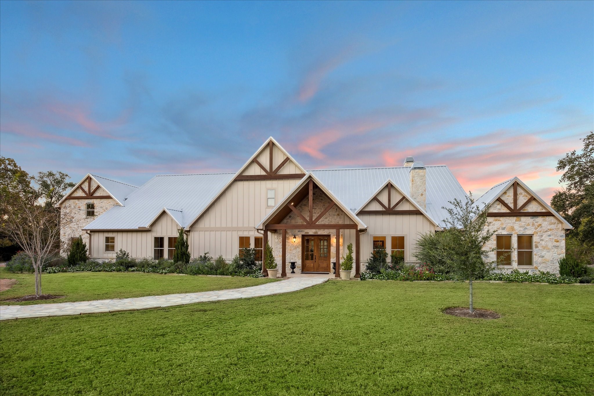 2130 Hartfield Road Round Top, TX 78954 - Photo 34 of 35 a front view of a house with a yard and trees