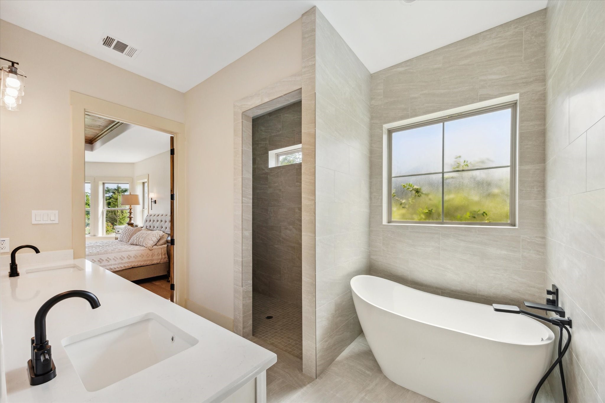 2130 Hartfield Road Round Top, TX 78954 - Photo 7 of 35 a bathroom with a bathtub and a sink