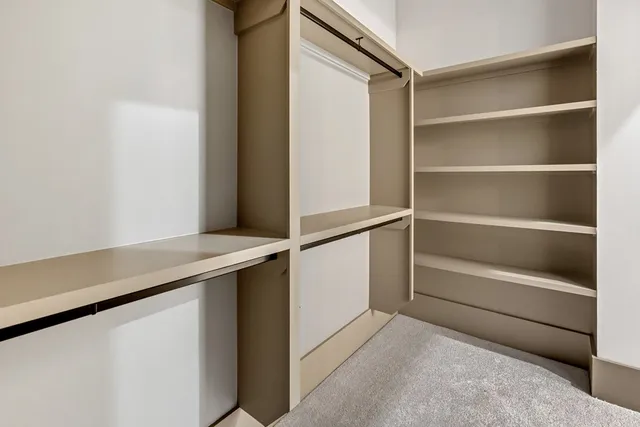 a view of an empty walk in closet