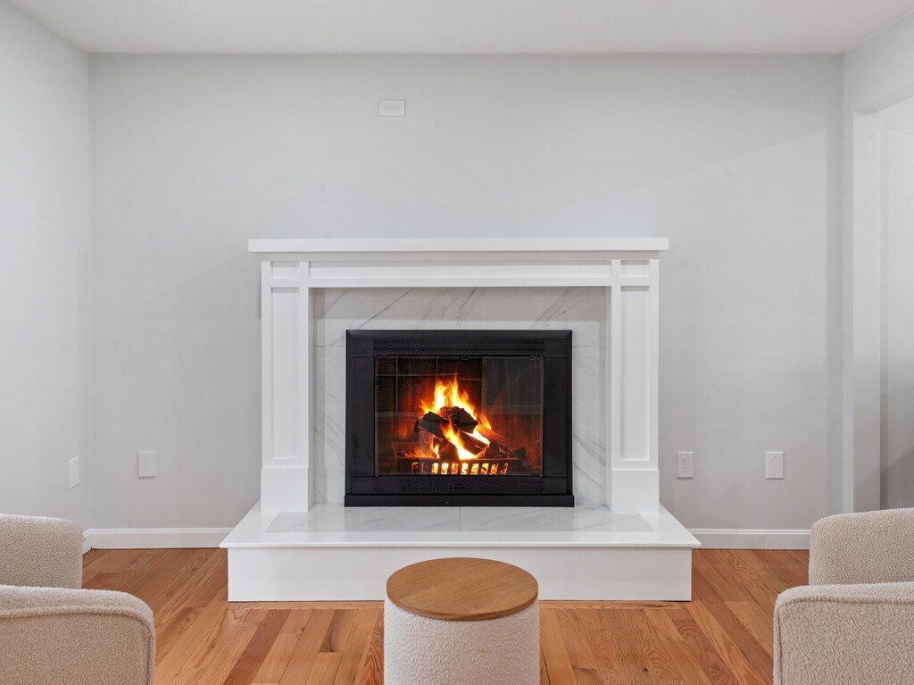 2 Stringer Dam Road Shrewsbury, MA 01545 - Photo 9 of 35 a living room with furniture a rug and a fireplace