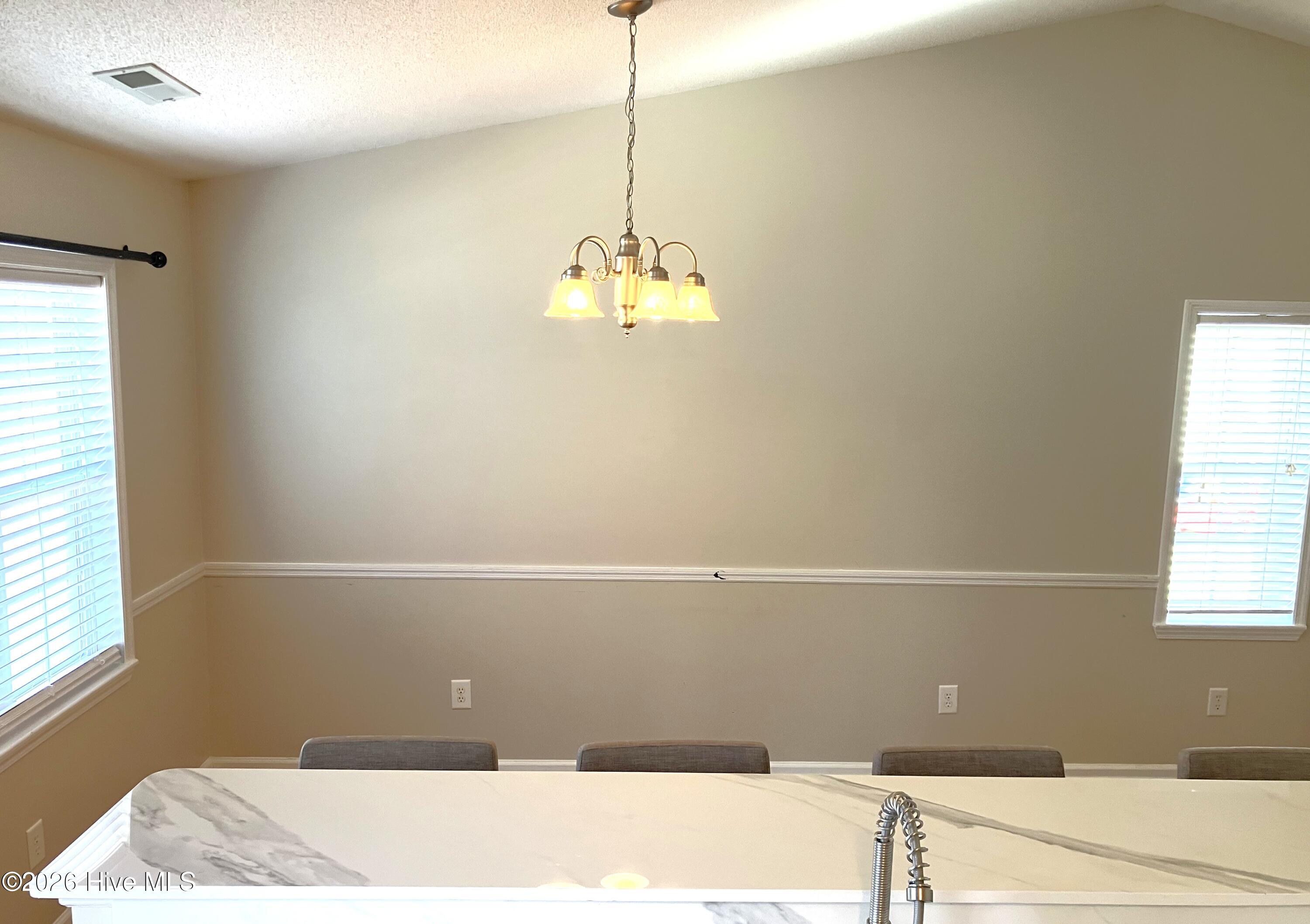 102 Poplar Ridge Road Jacksonville, NC 28546 - Photo 10 of 33 Raised bar to Dining Room