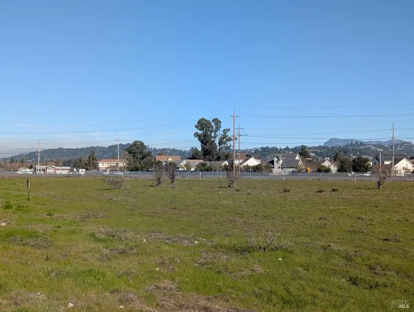 a view of a large building with a yard