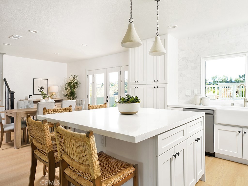 33271 Ocean Hill Drive Dana Point, CA 92629 - Photo 19 of 43 a kitchen with a stove a table and chairs