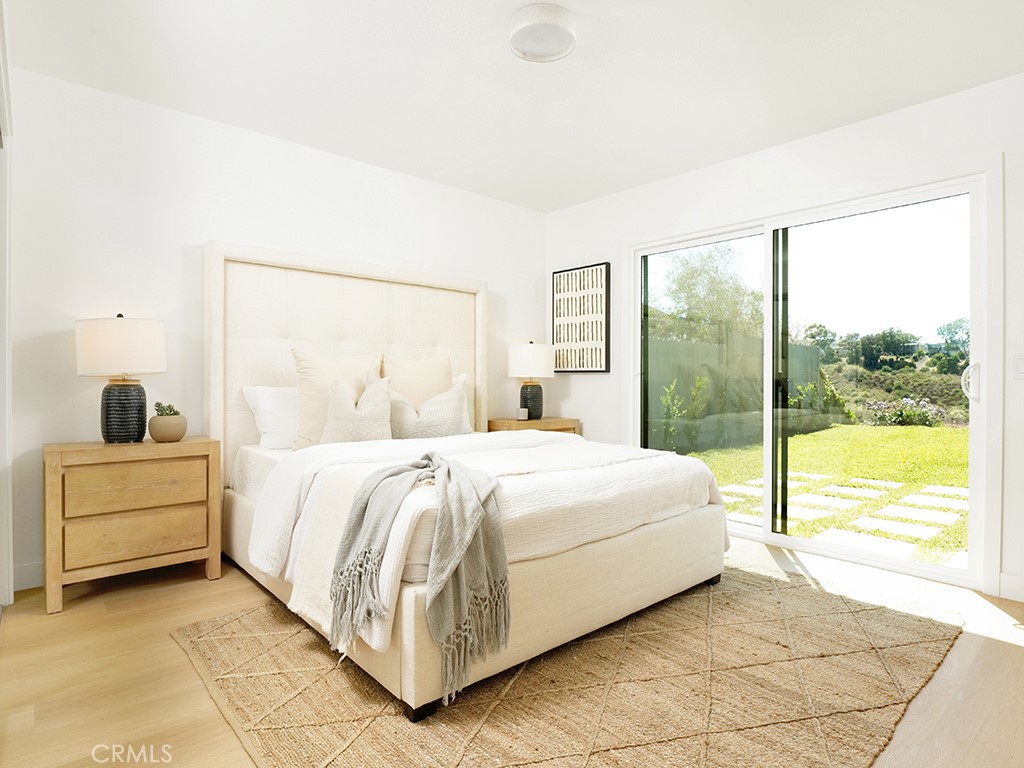 33271 Ocean Hill Drive Dana Point, CA 92629 - Photo 22 of 43 a bedroom with a bed and large window