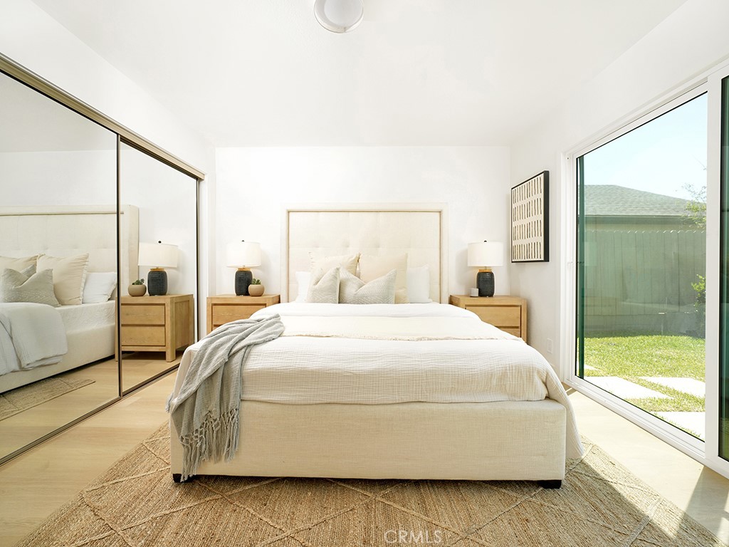 33271 Ocean Hill Drive Dana Point, CA 92629 - Photo 24 of 43 a spacious bedroom with a bed and large window