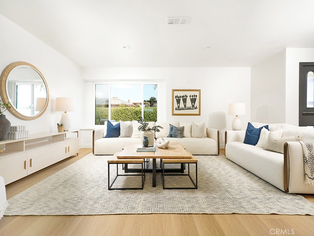 33271 Ocean Hill Drive Dana Point, CA 92629 - Photo 5 of 43 a living room with furniture a rug and a large window