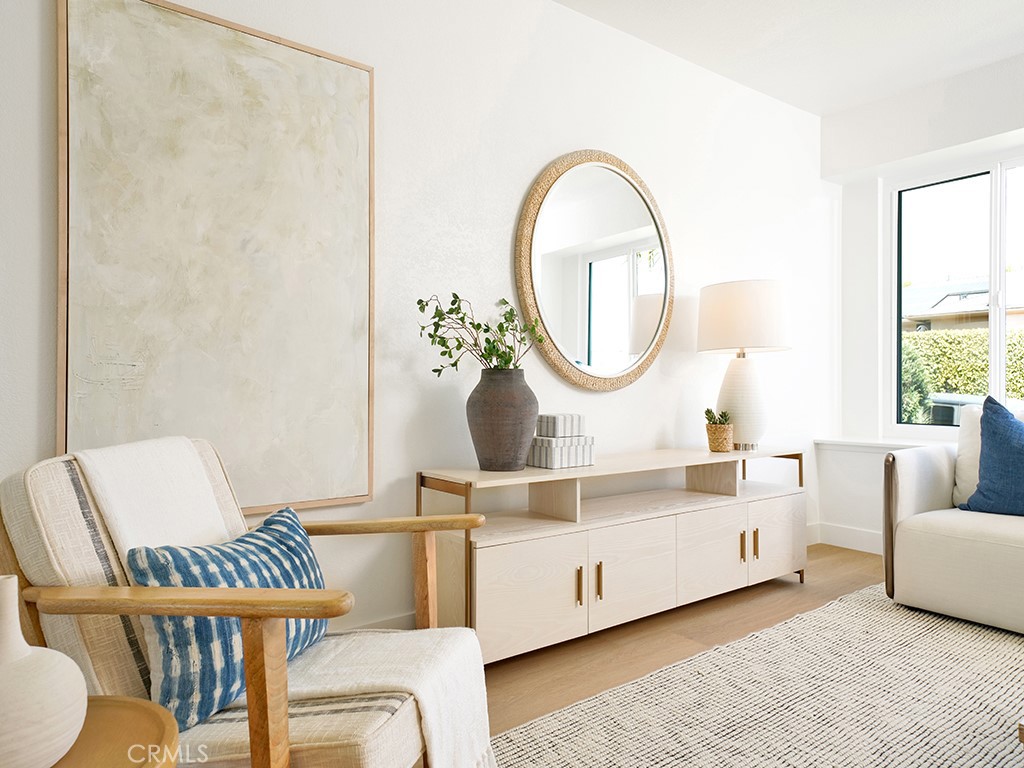 33271 Ocean Hill Drive Dana Point, CA 92629 - Photo 7 of 43 a living room with furniture a mirror and a table