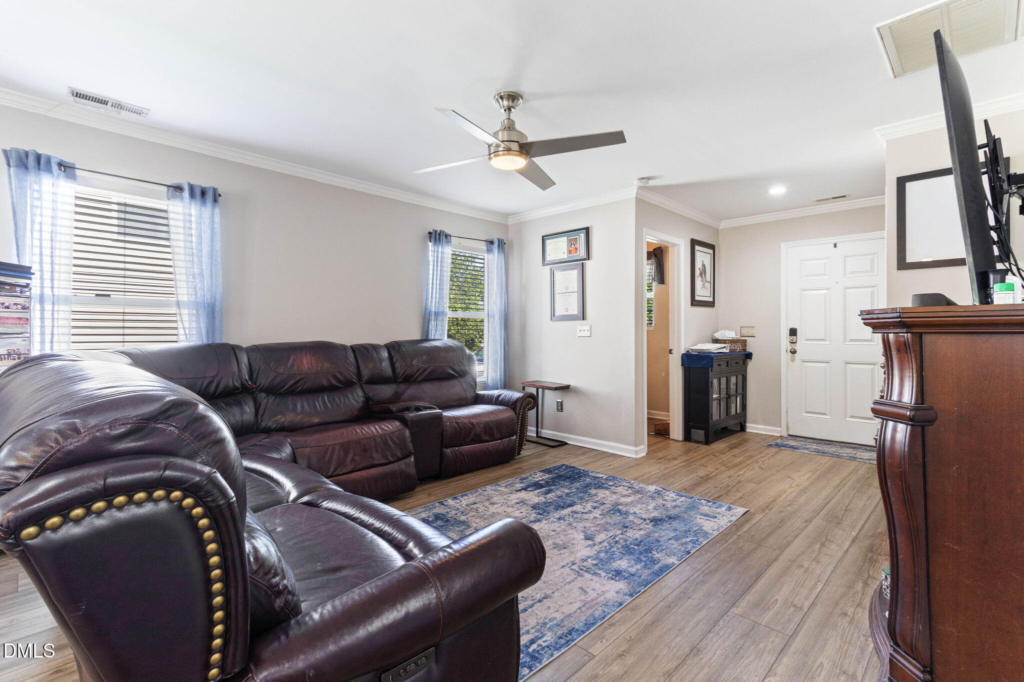 3713 Marshlane Way Raleigh, NC 27610 - Photo 9 of 38 a living room with furniture and a fireplace